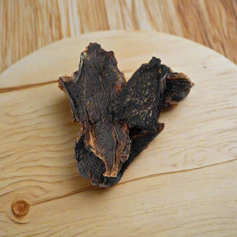 Kangaroo Jerky pet treats on chopping board