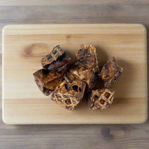 Lamb Lung Cube dog treats on chopping board