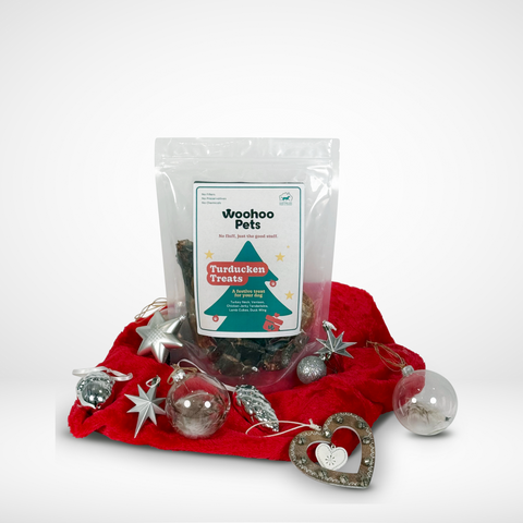 Limited edition Xmas pack surrounded by Xmas ornaments